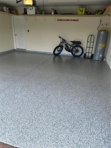 Garage featuring water heater