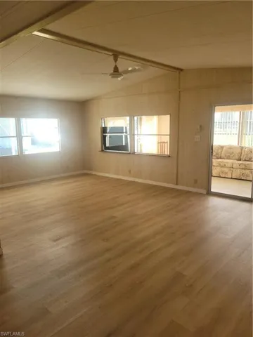 Large open living room opens up to West facing sunroom.