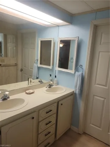 Primary bathroom with dual vanity.