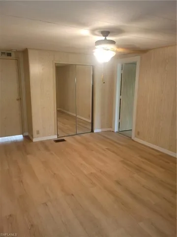 Large primary bedroom has mirrored closet doors and an additonal walk-in closet + bonus room.