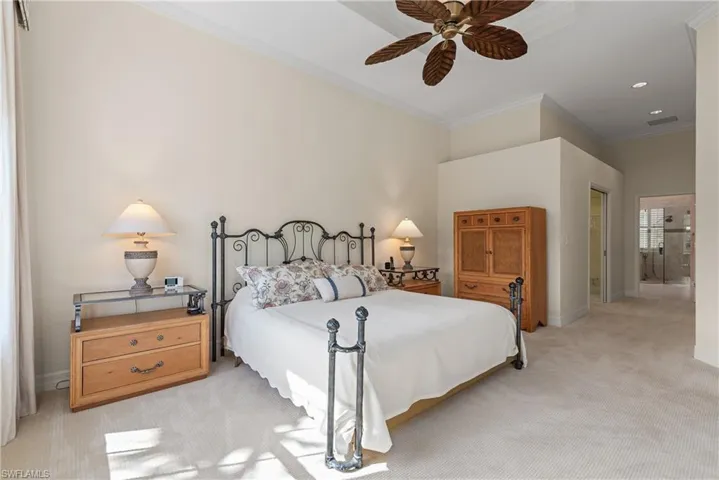 Bedroom with ornamental molding, light colored carpet, a closet, ceiling fan, and recessed lighting