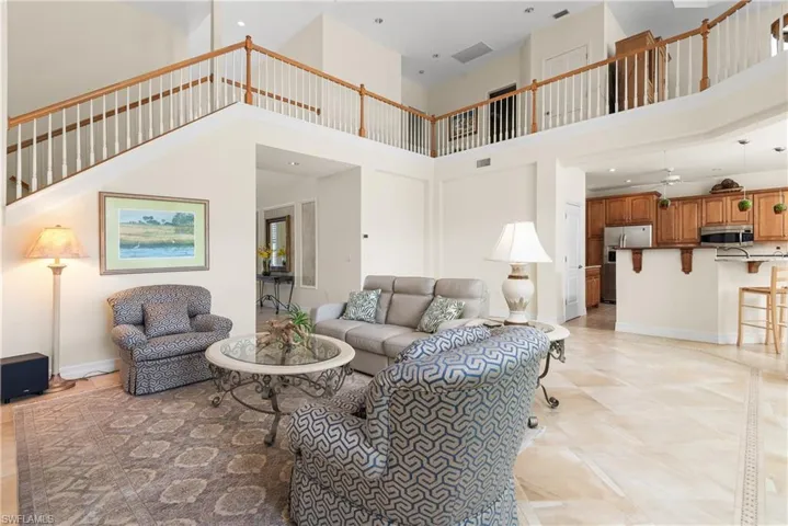 Living room with a high ceiling and recessed lighting