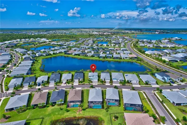 Birds eye view of property featuring a water view