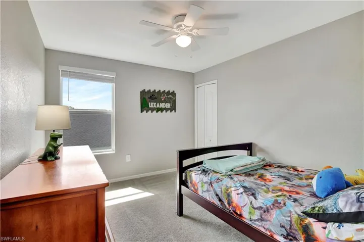 Bedroom featuring carpet flooring and ceiling fan