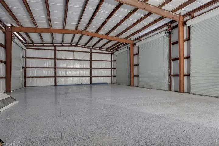 Garage featuring metal wall