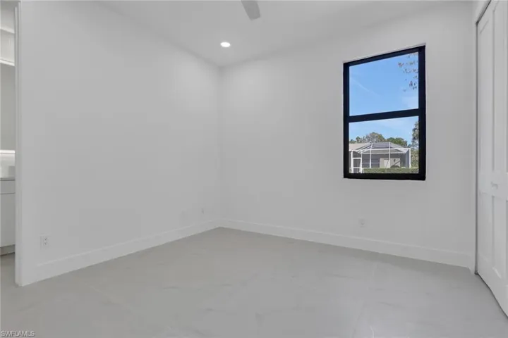 Empty room featuring recessed lighting and a ceiling fan