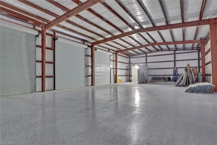 Garage featuring metal wall