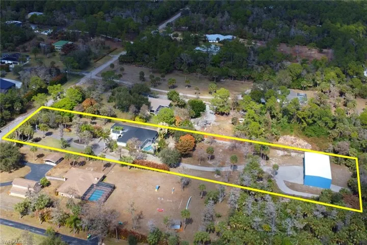 Aerial view of property and surrounding area with property boundaries highlighted