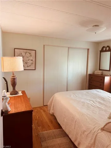 Bedroom with wood finished floors