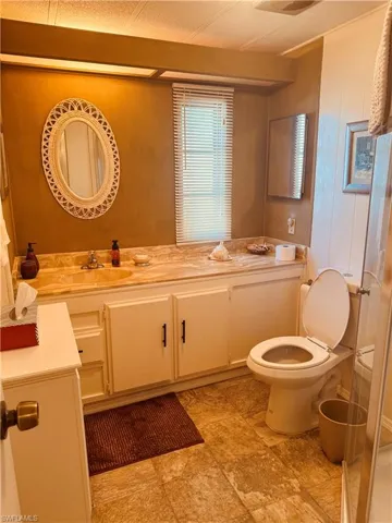 Bathroom with vanity and stone finish flooring