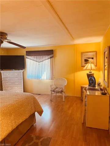Bedroom with light wood-style flooring and ceiling fan