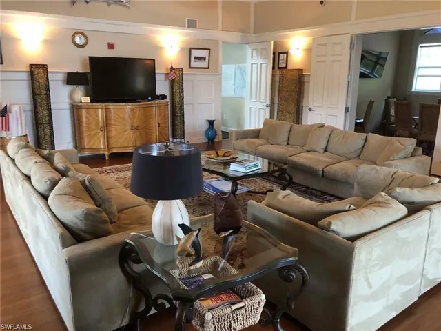 Living room with wood-type flooring