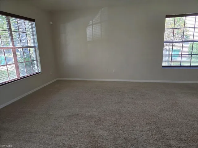 Carpeted Family room with plenty of Natural Light room.