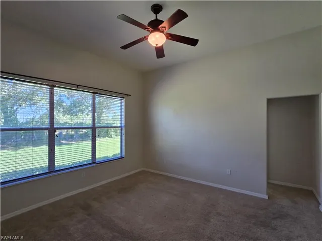 Master bedroom featuring carpet and a ceiling fan