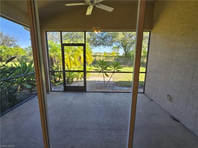 Screened Lanai featuring a ceiling fan and healthy amount of natural light