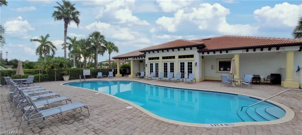 Community pool featuring a patio