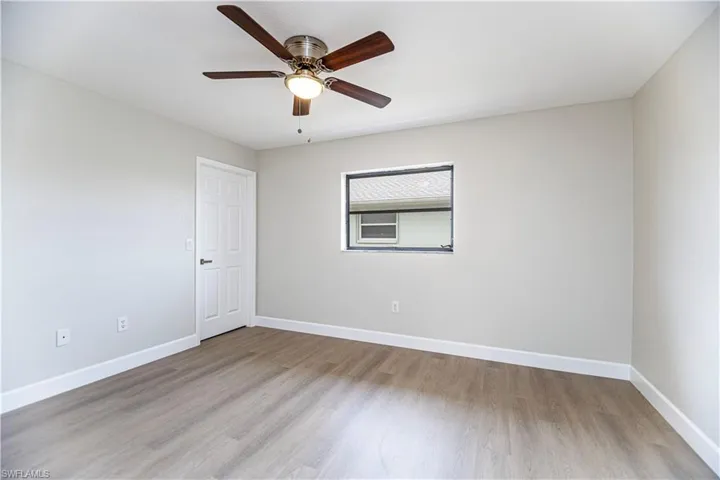 Empty room featuring light hardwood / wood-style floors and ceiling fan