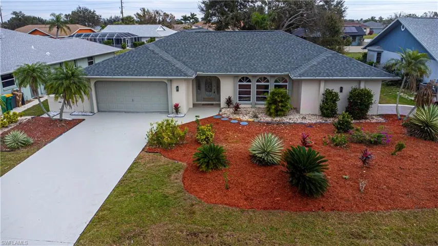 Single story home featuring a garage