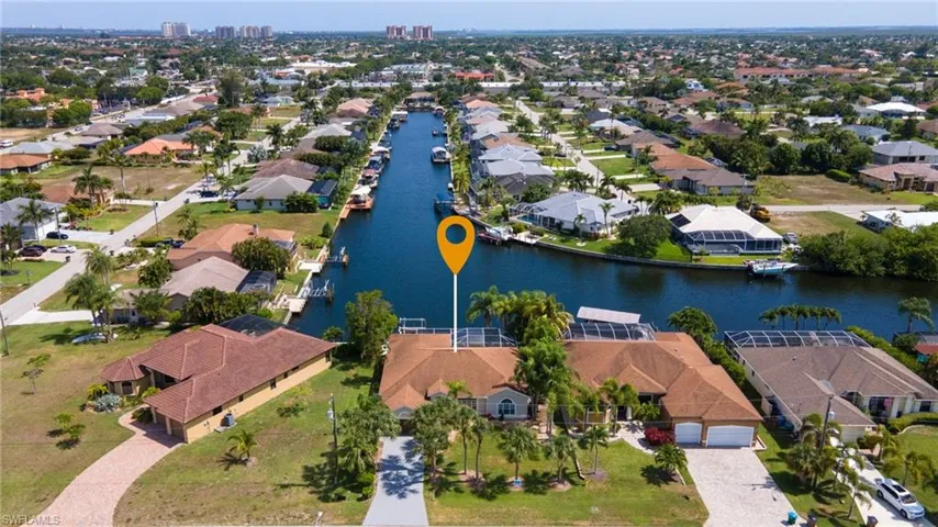 Birds eye view of property featuring a residential view and a water view