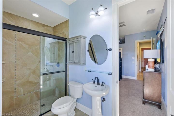 3rd Full Bath with a Step In Shower, and Pool Bath Door to Verandah