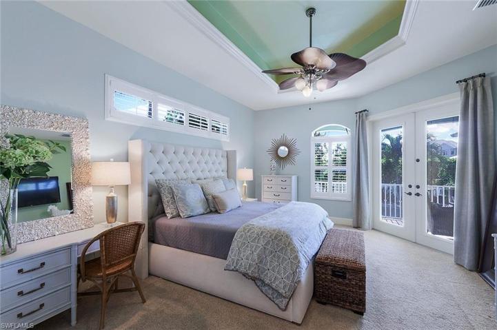 Owner Suite, Shown with a King Bed, Tray Ceiling, French Doors to the Verandah