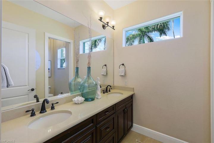 Center Full Bath with Dual Sinks and Tub/Shower Combination. This Bath Doubles as a Guest Bath or Hall Bath, Located on Great Room Side of the Home
