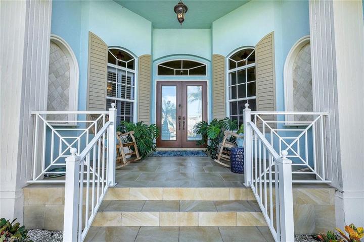Lovely Key West Style, Double Door Entry with Tiled Front Porch