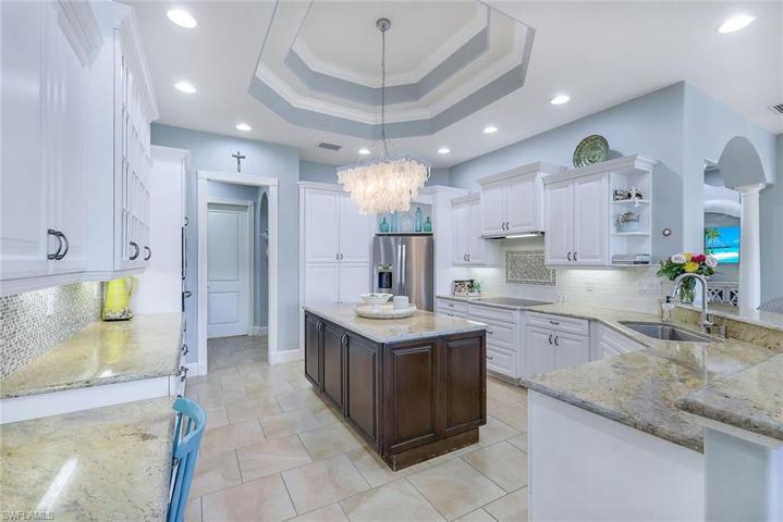 Custom Cabinets, Tiled Back Splash, Upper Level Granite, SS Appliances, Pantry with Pull Outs