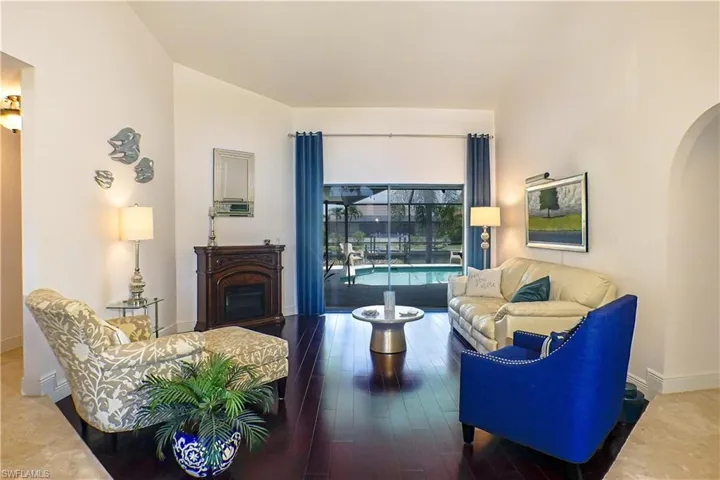Living room with hardwood / wood-style flooring