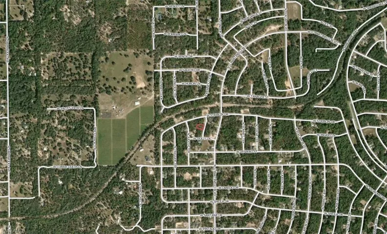 Aerial Map. Displaying the property's location within a residential and undeveloped area