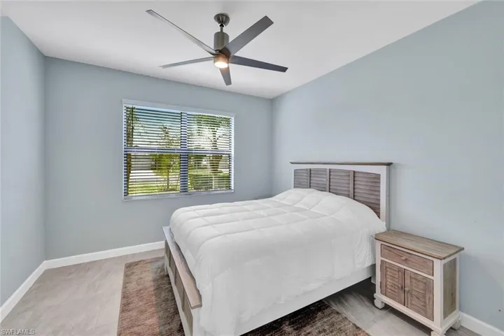 Bedroom featuring baseboards and ceiling fan