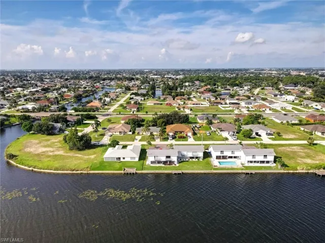 Waterfront properties featuring backyard pools, multiple boat docks, and direct water access