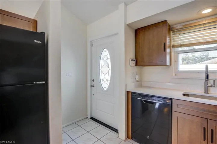 White entry door with decorative glass inserts