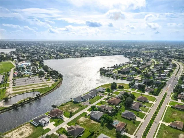 Expansive waterways, numerous residential properties, and clear skies