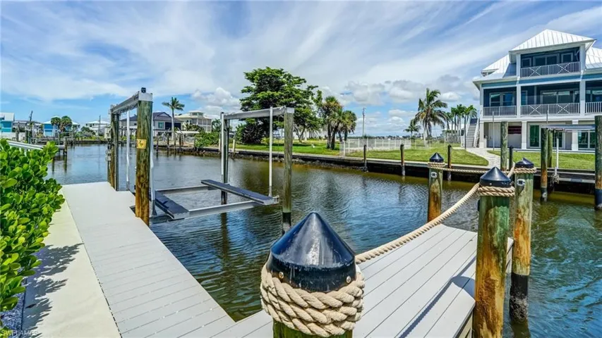 Lets go BOATING, Dock with a water view and boat lift - Virtually Edited Image