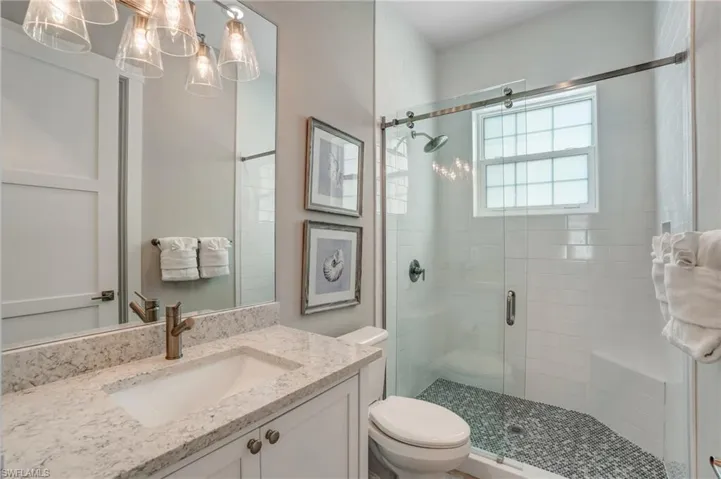Bathroom with a shower stall and vanity - Virtually Edited Image