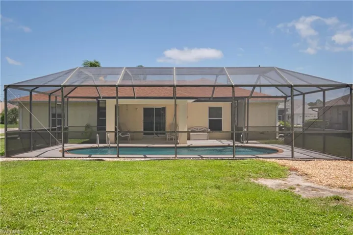 Beautiful corner lot with mature palm trees.