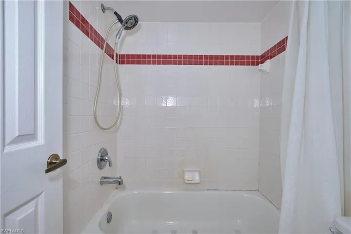 Primary Bathroom.  Tiled shower/bathtub.