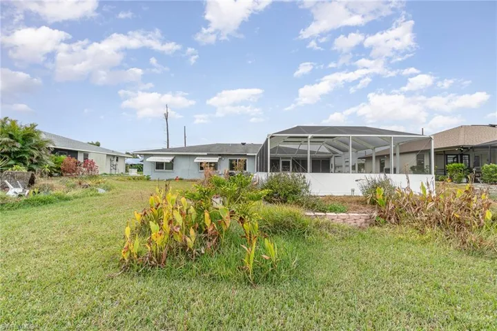 View of yard featuring a lanai