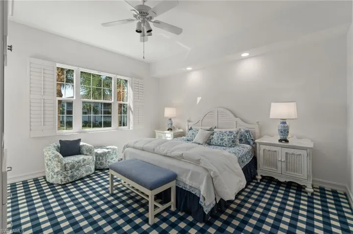 Primary bedroom with another great view of the lake and fountain