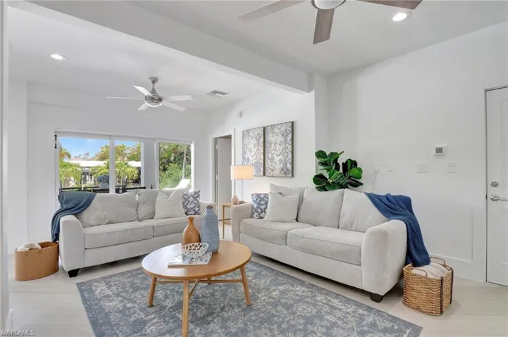 Living area featuring recessed lighting and ceiling fan