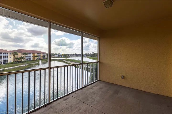 Unfurnished sunroom with a water view