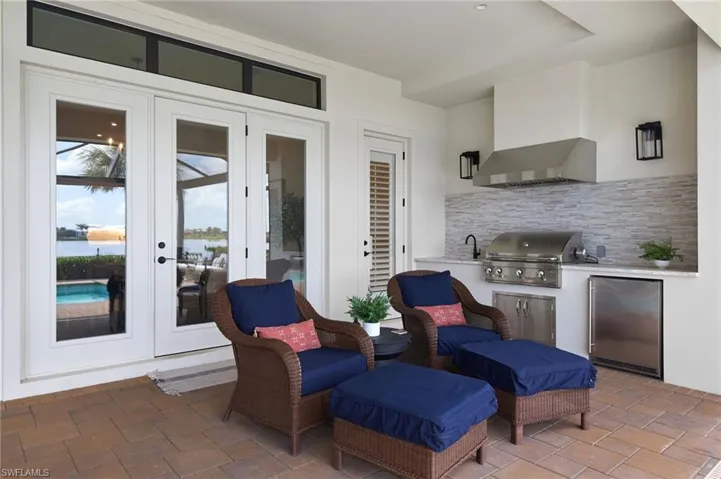 View of patio / terrace with sink, an outdoor kitchen, french doors, and area for grilling