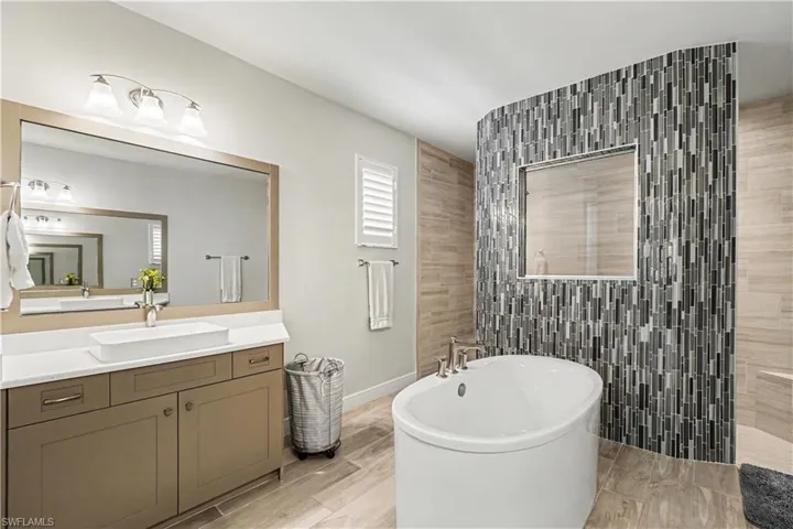Primary bath includes Large dual vanities and soaking tub with separate walk in shower.