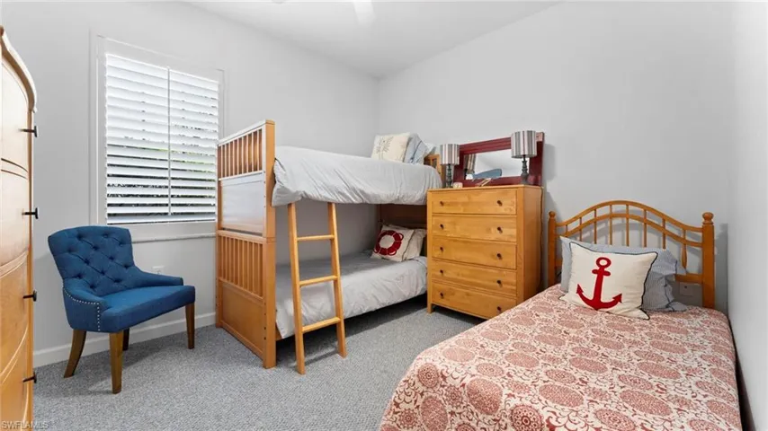 Bedroom featuring carpet and ceiling fan