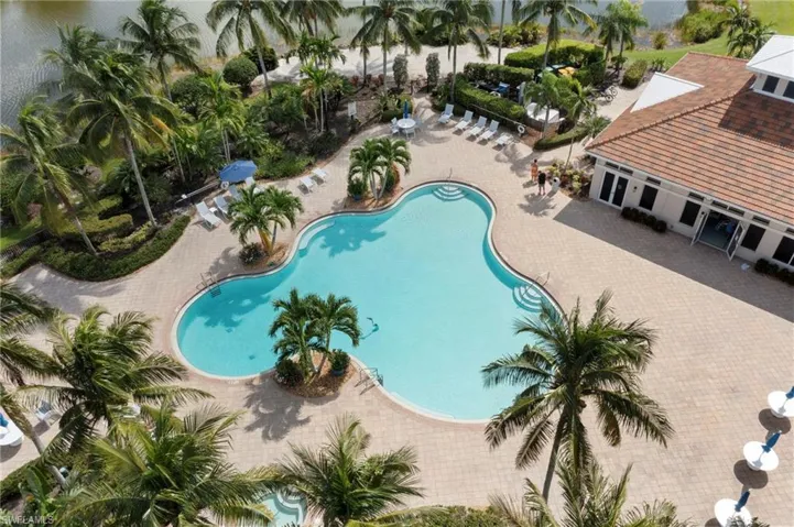 View of resort style swimming pool w/spa