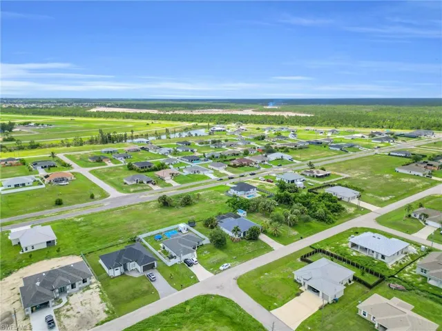 Aerial perspective of suburban area with a large body of water