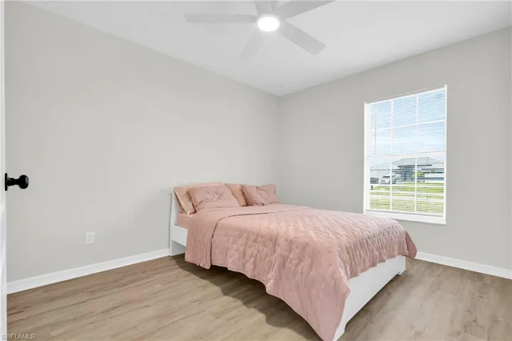 Bedroom featuring light wood-style flooring and ceiling fan