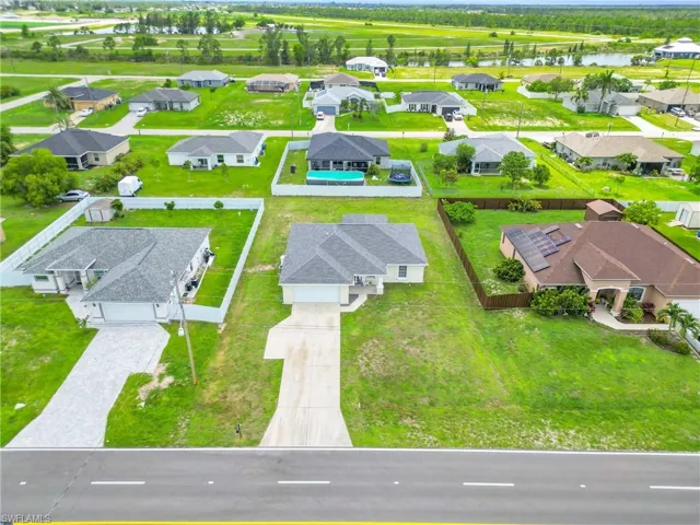 Aerial perspective of suburban area with a large body of water
