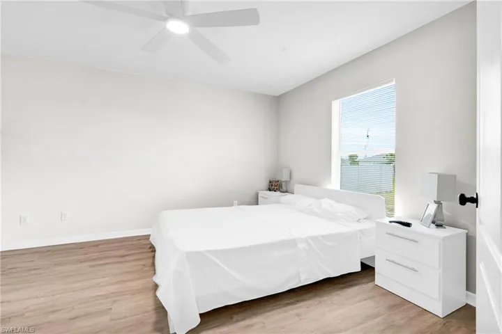 Bedroom featuring light wood-type flooring and a ceiling fan